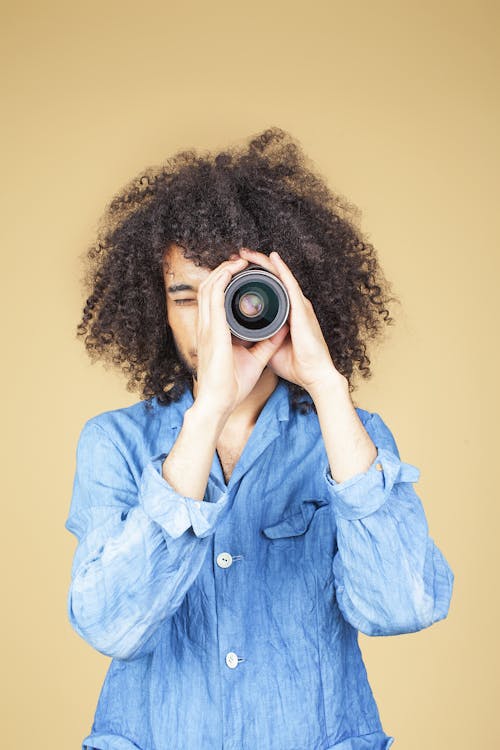 Free Man Wearing Blue Shirt Using Telescope Stock Photo