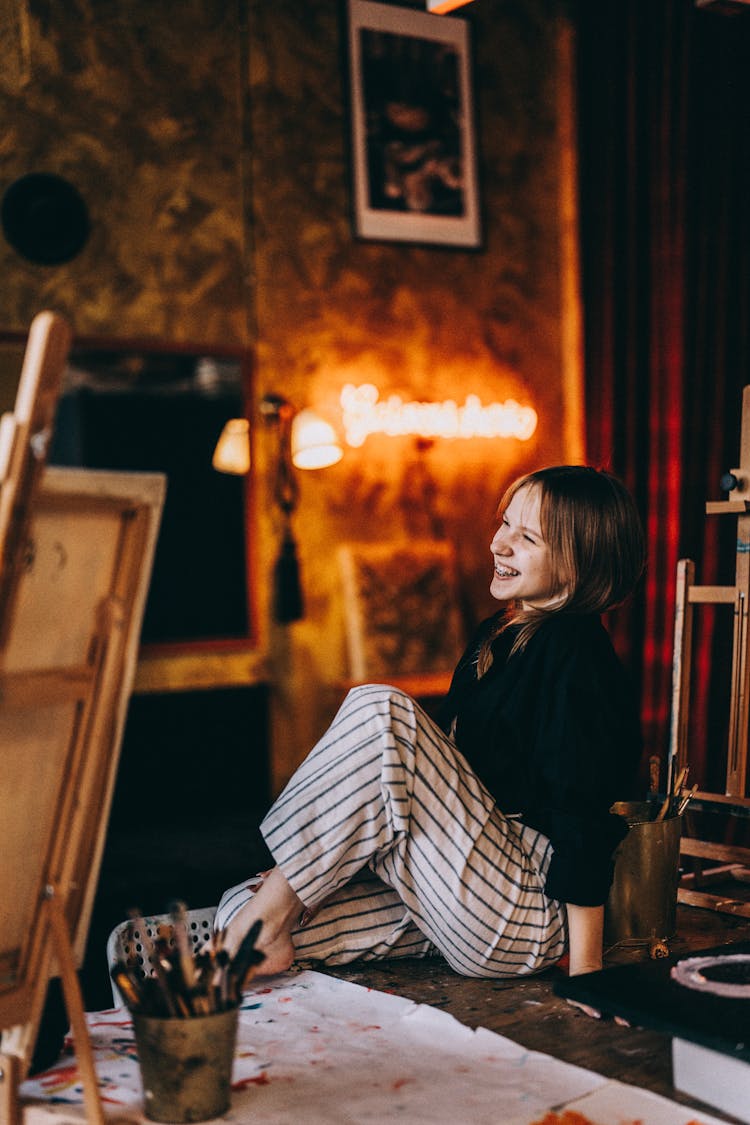 Young Girl Sitting In An Art Studio