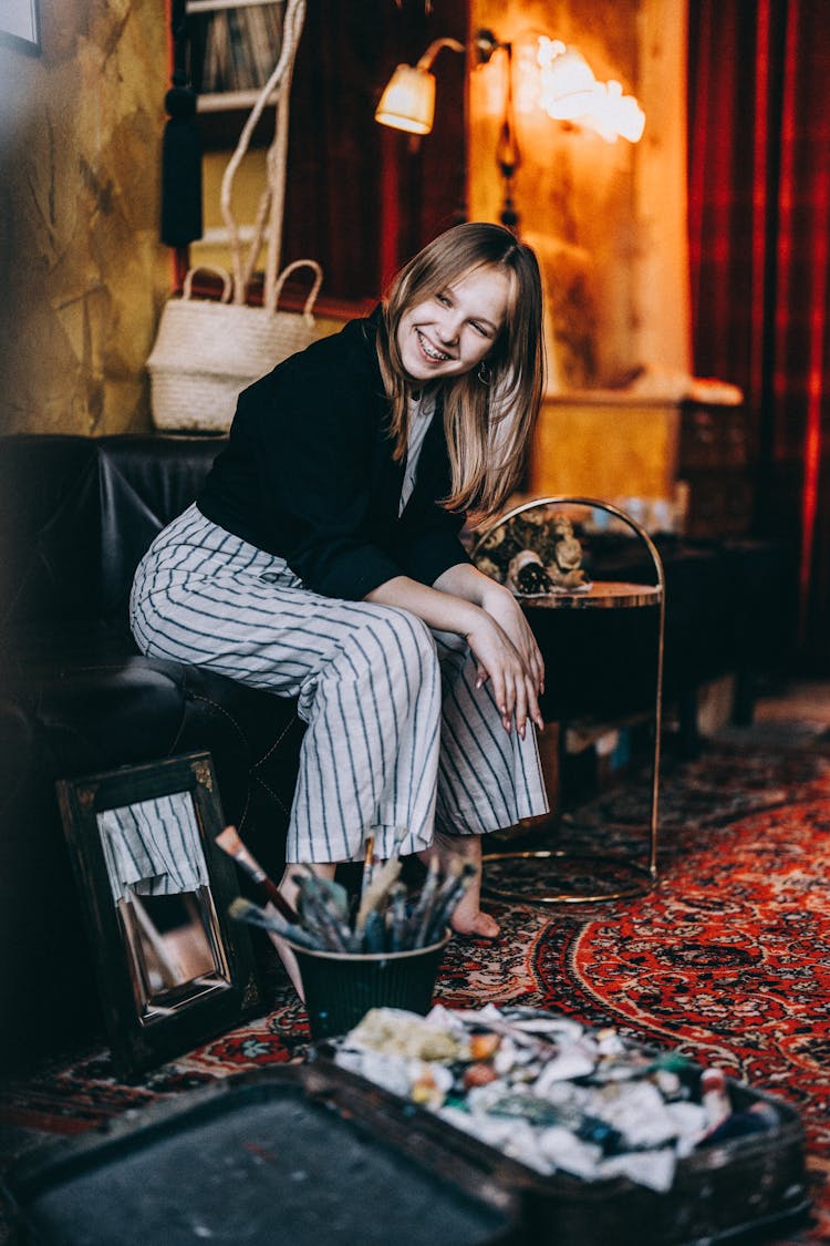 Young Girl Sitting In An Art Studio