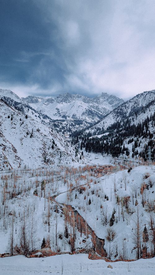 Free Breathtaking view of snow-covered mountains and valley in Almaty, Kazakhstan during winter. Stock Photo