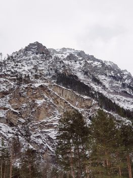 Breathtaking view of a majestic snowcapped mountain peak in winter.