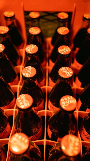 Close-up of Coca-Cola Zero bottles in crate, vibrant setup in Istanbul.