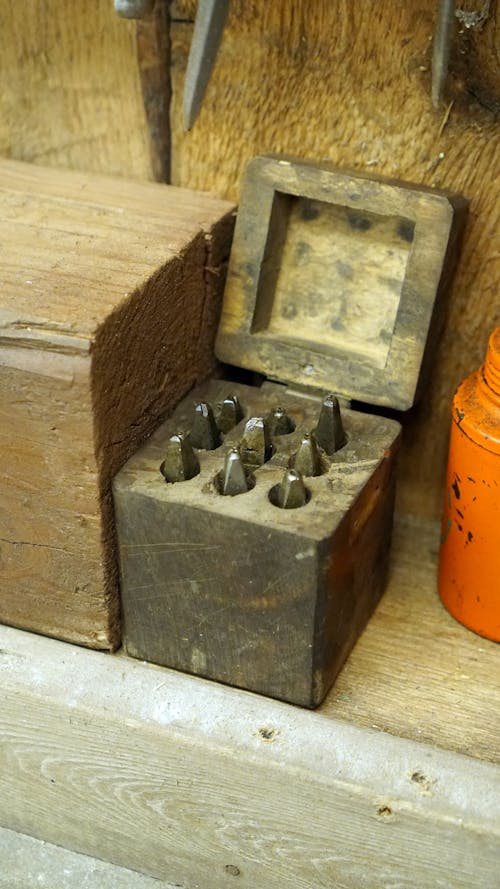 Close-up of an Old Wooden Box with Metal Tools 