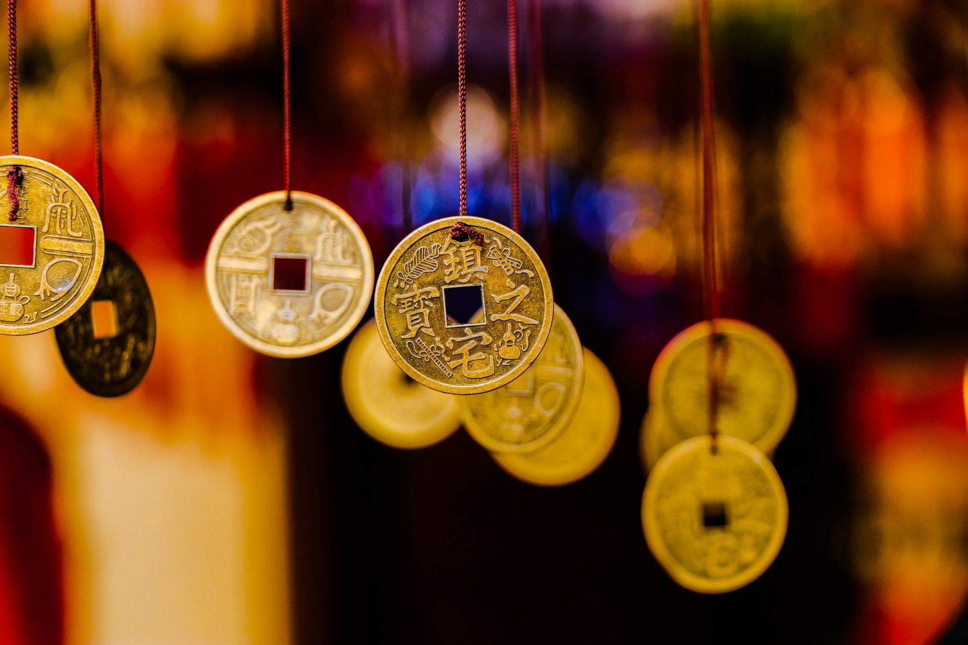 A vibrant display of hanging Feng Shui coins, symbolizing wealth and prosperity.