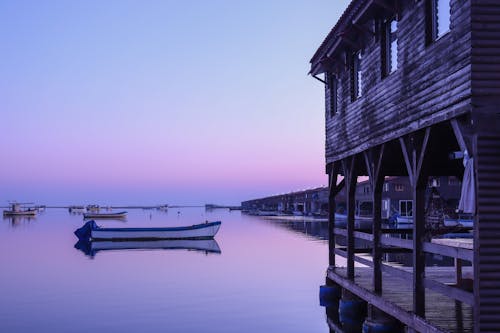 Бесплатное стоковое фото с деревянная деревня, закат, морская жизнь