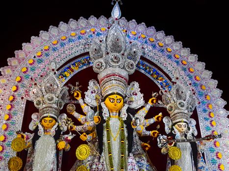 Colorful depiction of Goddess Durga during a vibrant Durga Puja festival in Kolkata, India.