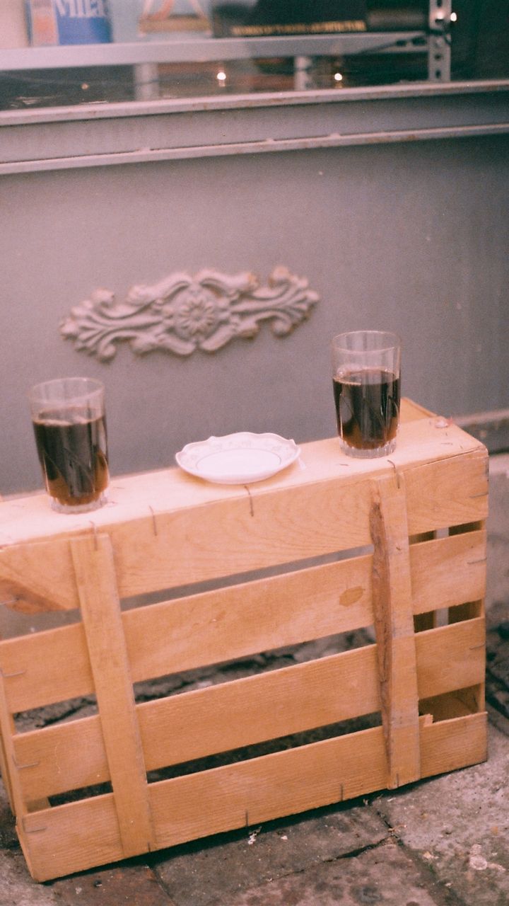 stacked wooden crates in a corner used as a rustic small coffee bar