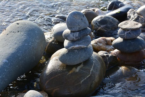 Free Close-up of a Pile of Stones on the Shore  Stock Photo