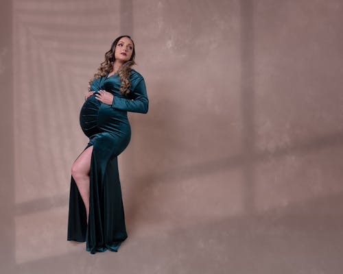 Pregnant Woman Posing in Dress