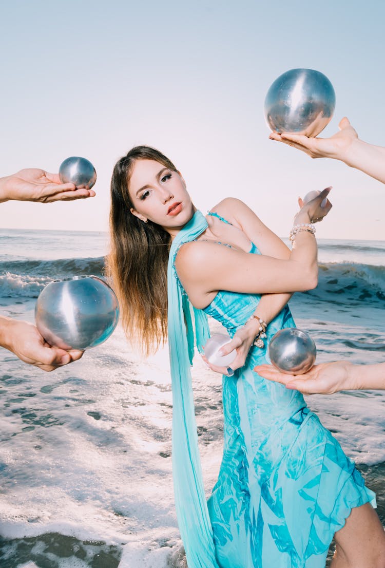 Model In A Blue Dress Posing On The Beach 