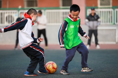 Boys Playing Football 