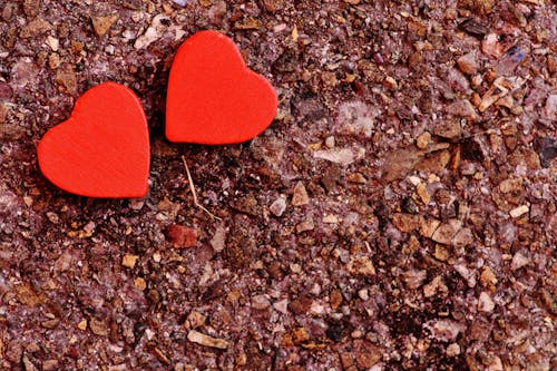 Two Red Heart Decoration on Ground