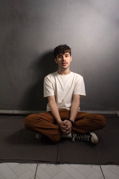 Man Sitting and Posing in T-shirt