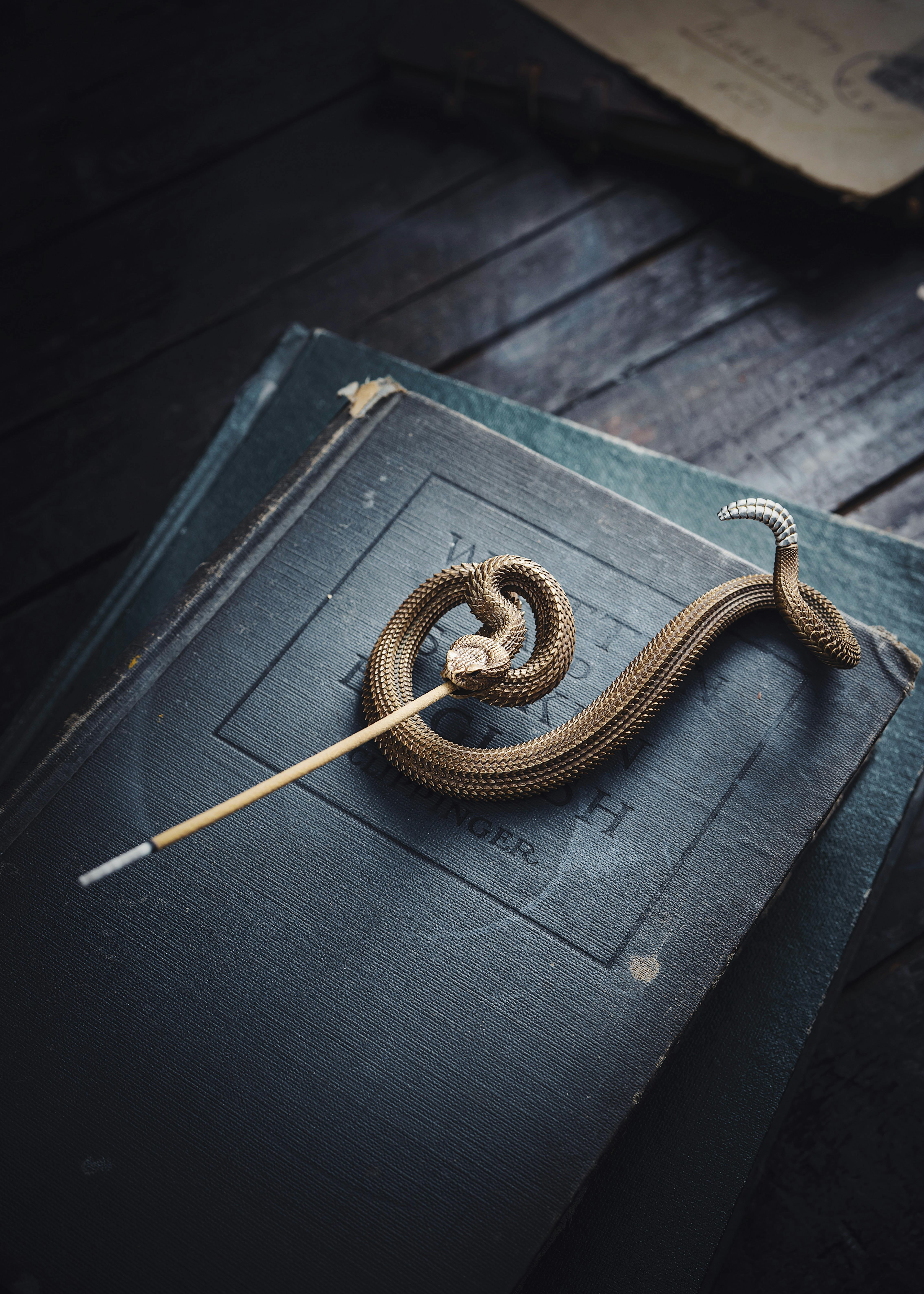 an incense holder in the shape of a snake