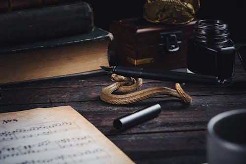 A Quill Pen on a Holder in the Shape of a Snake 