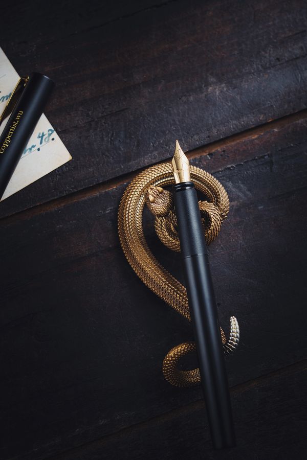 A quill pen on a holder