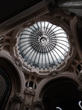 Art Nouveau dome ceiling in Buenos Aires showcasing intricate glasswork and architecture.