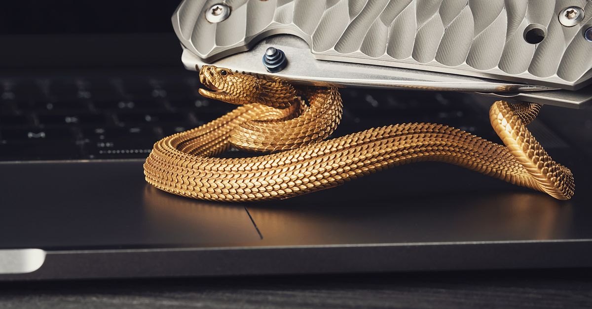 Snake Inside Computer Case Snake Figurine on Laptop with Knife · Free Stock Photo