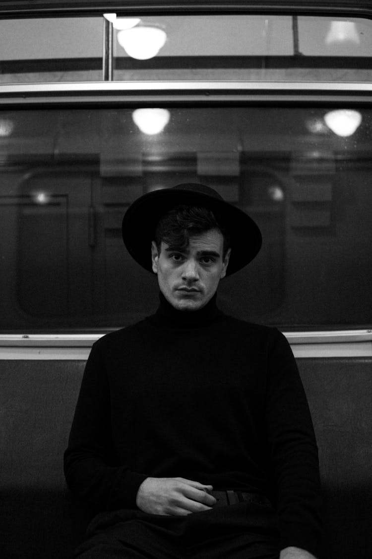 Man In A Turtleneck And A Hat In A Subway 