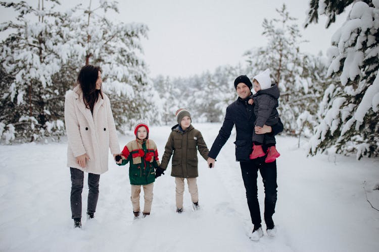 Family Having Fun On Snow