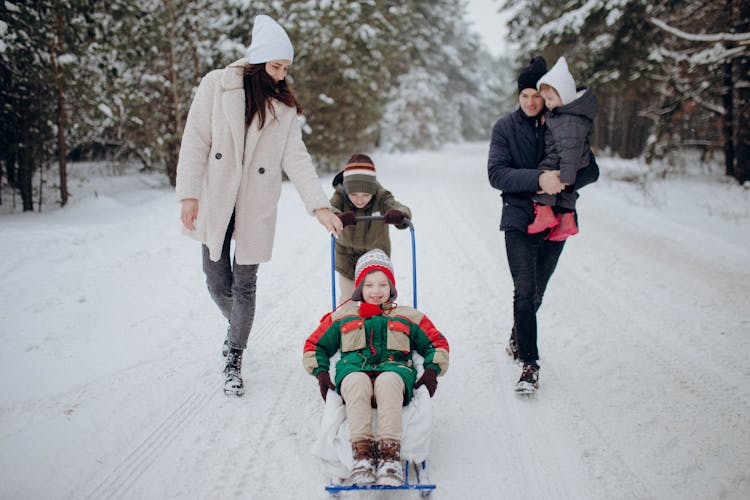 Family Having Fun On Snow