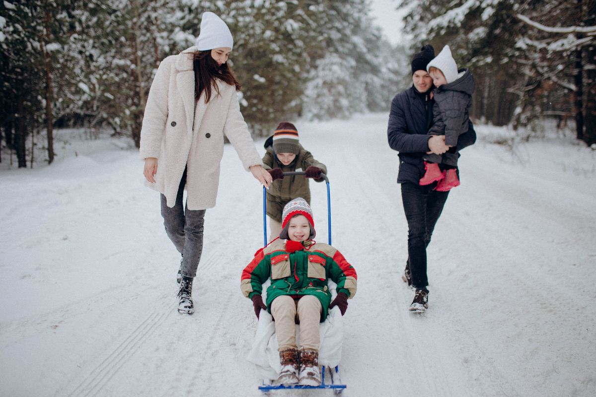 A Family Having Fun Playing in the Snow · Free Stock Photo
