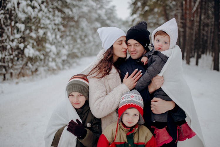 Family Having Fun On Snow