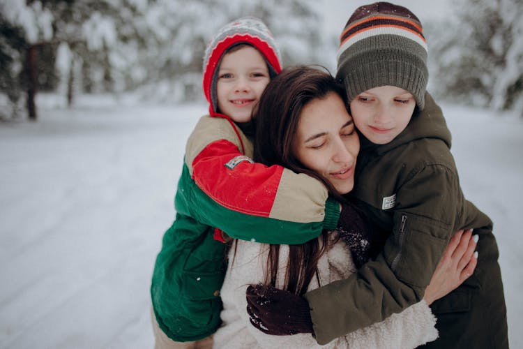 Family Having Fun On Snow