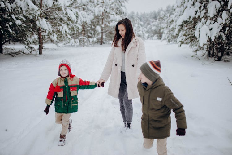  Family Having Fun On Snow