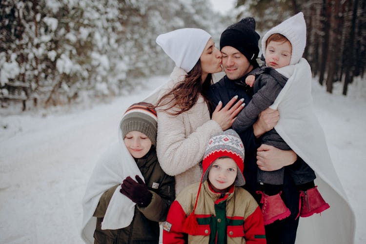 Family Having Fun On Snow