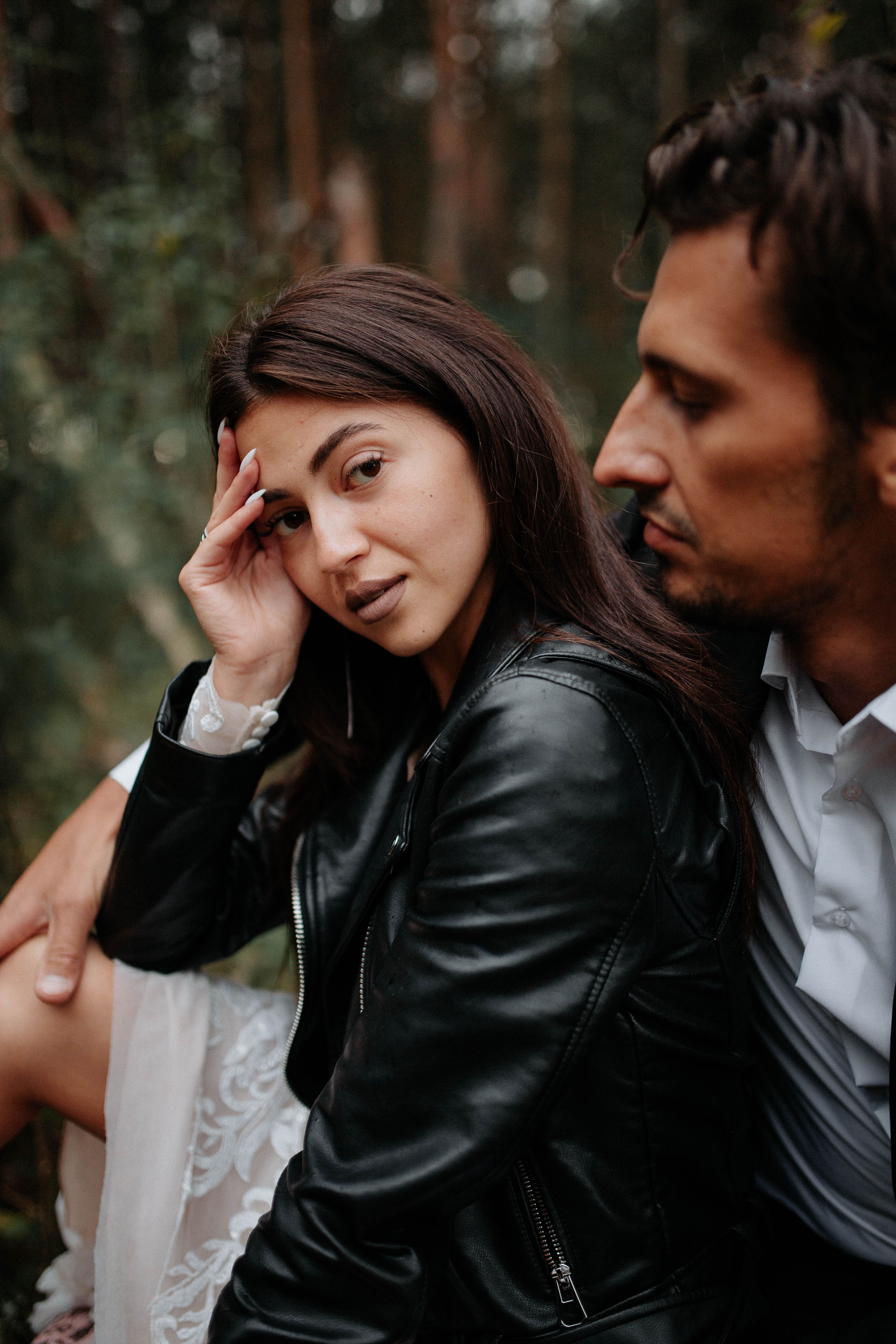A Couple Sitting Close in the Forest · Free Stock Photo