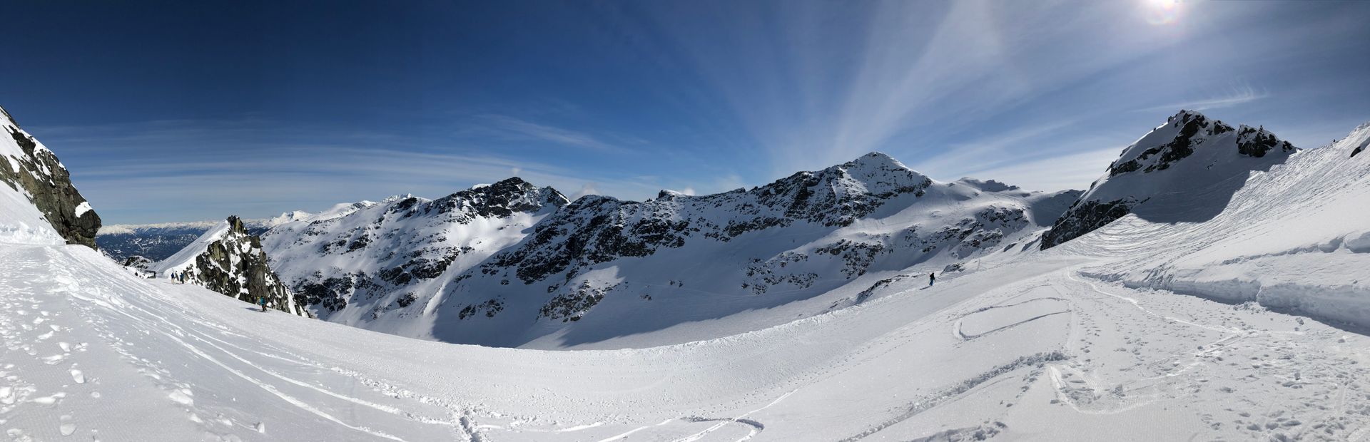 Snow-capped mountains under blue sky in British Columbia, Canada