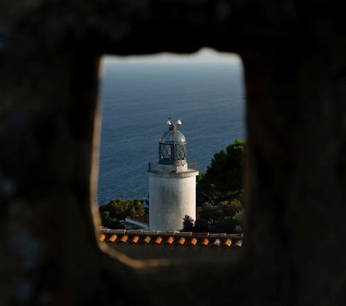 San Sebastian Lighthouse Seen through a Hole in the Wall
