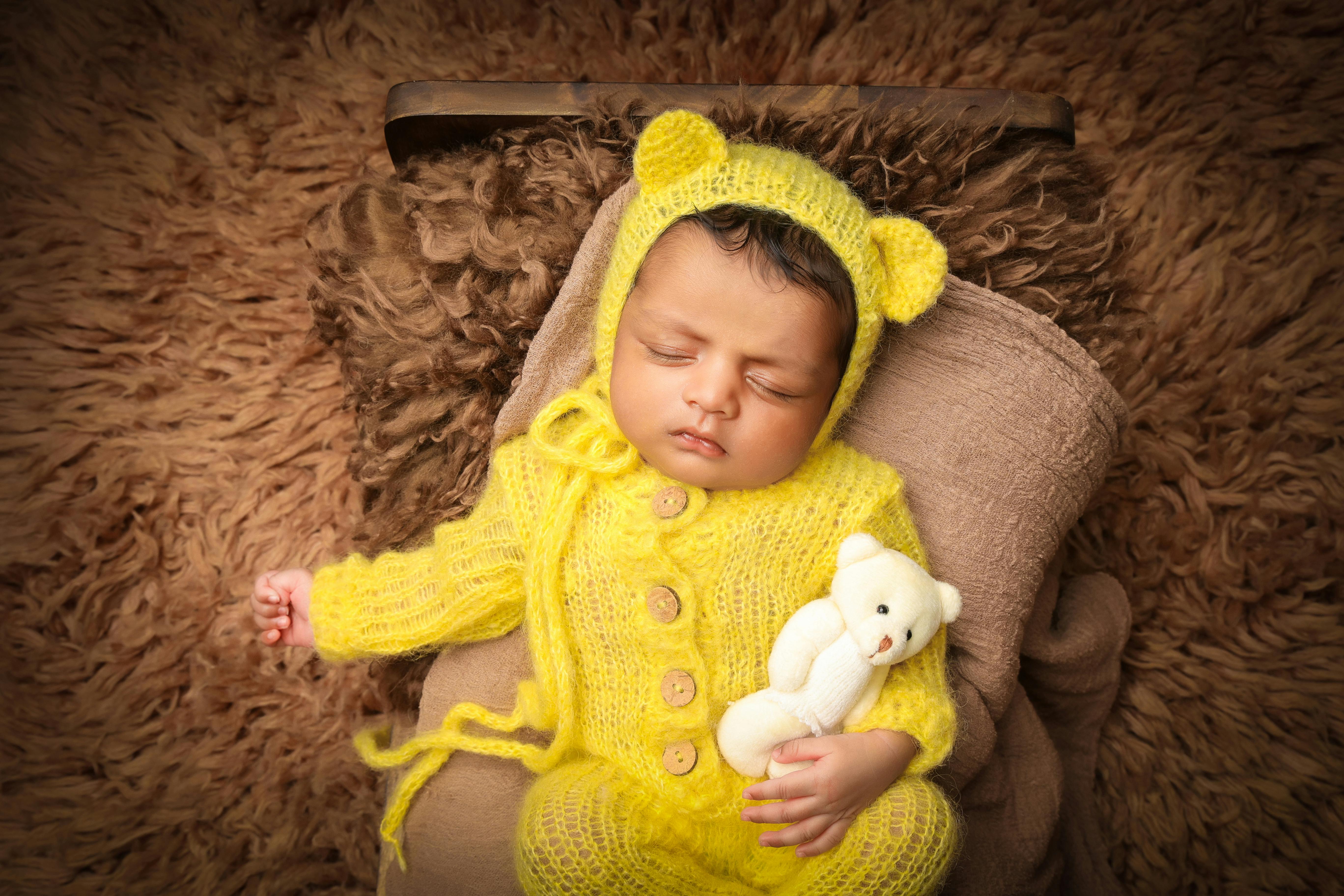 Newborn Sleeping in Bed · Free Stock Photo