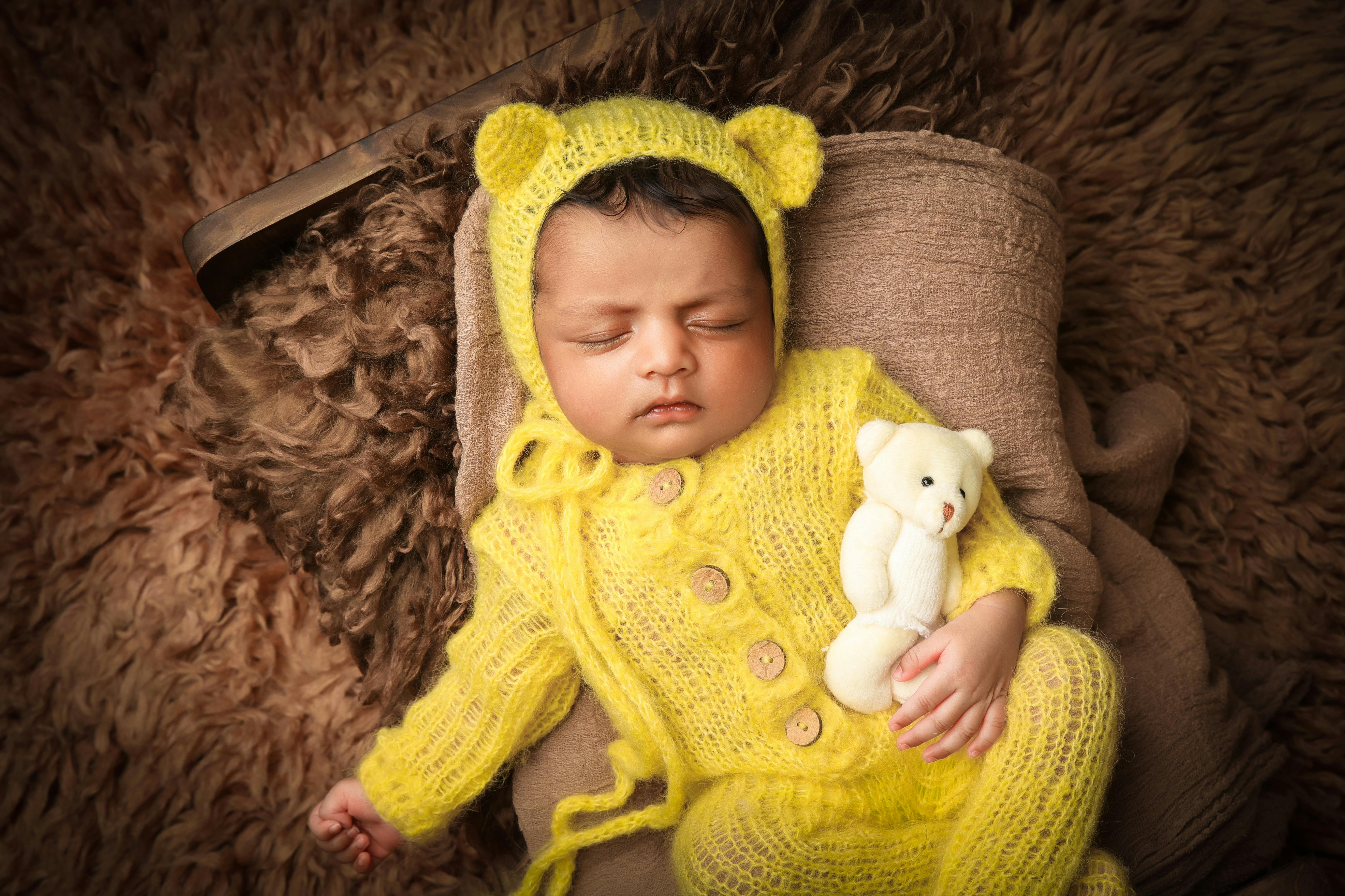 Newborn Sleeping in Bed · Free Stock Photo