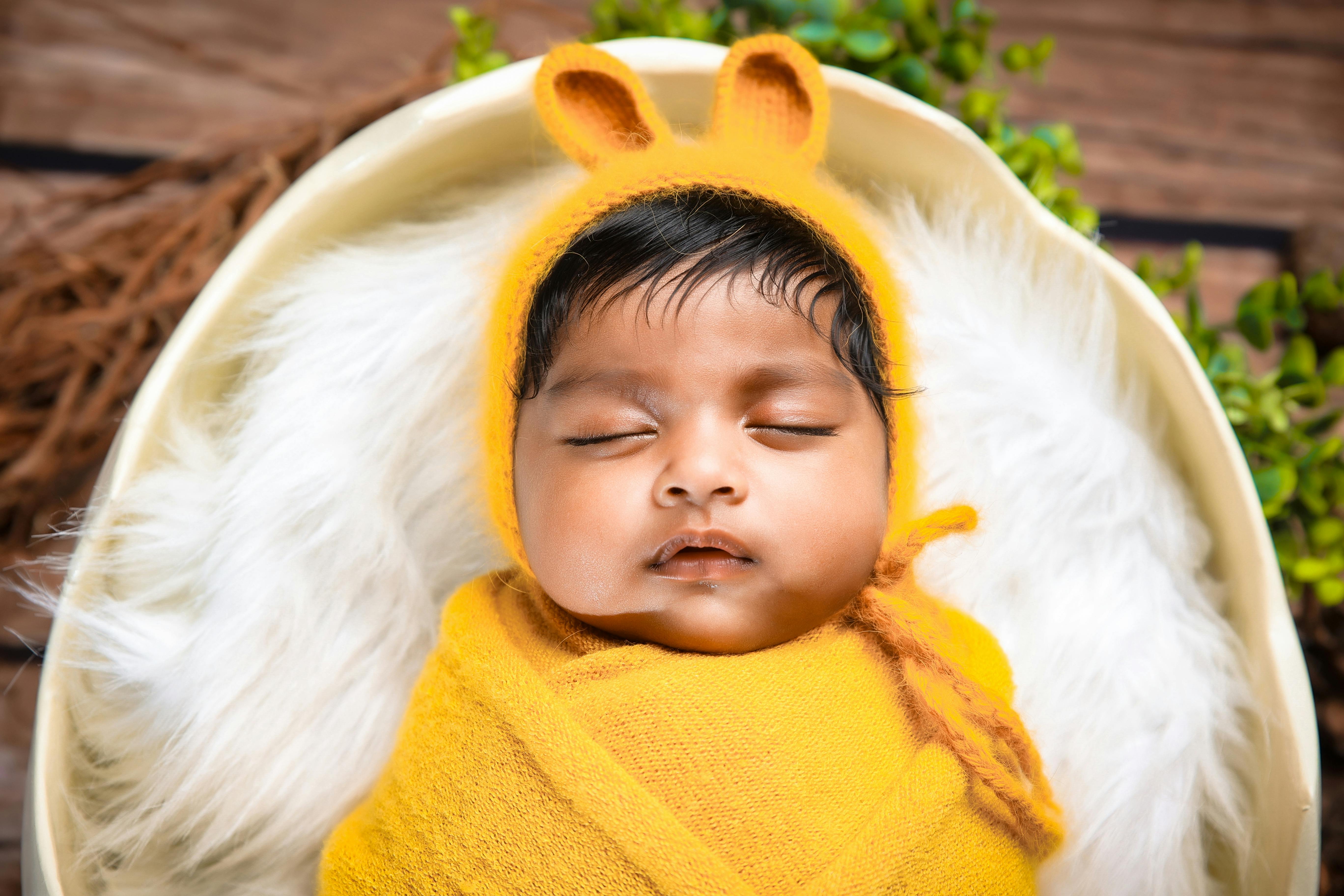 Newborn Sleeping in Bed · Free Stock Photo