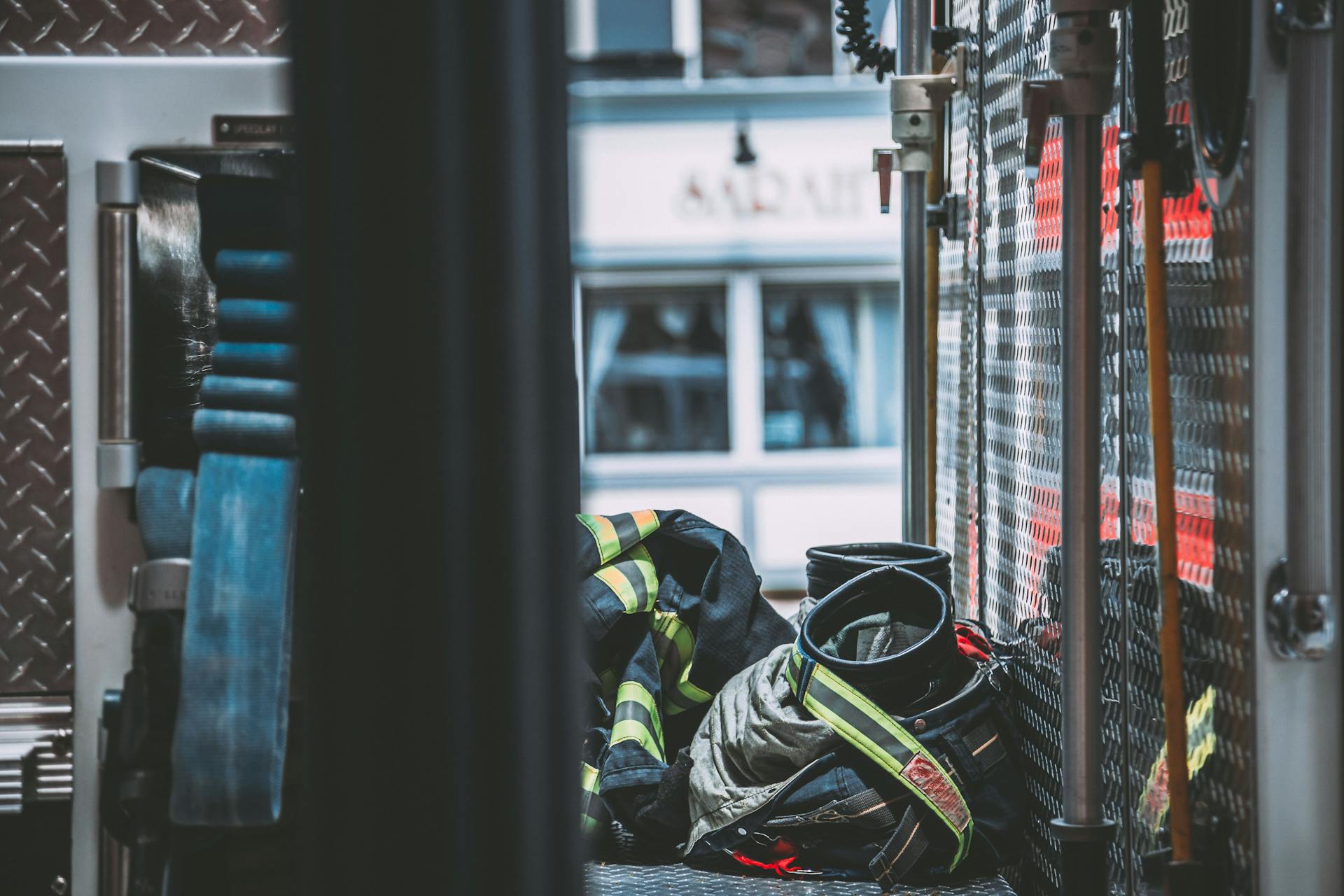 Firefighters Uniform on the Floor of a Fire Engine