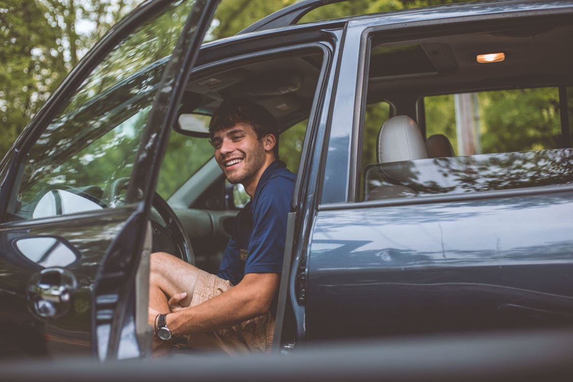 Free Man Inside Vehicle in Front of Opened Door Stock Photo