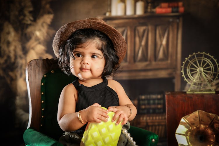 Cute Baby Girl Holding A Purse