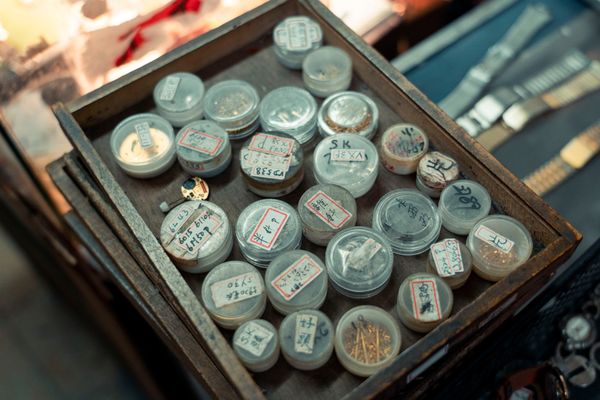 Tray of labelled watch parts in a workshop — photo by Jimmy Liao on Pexels