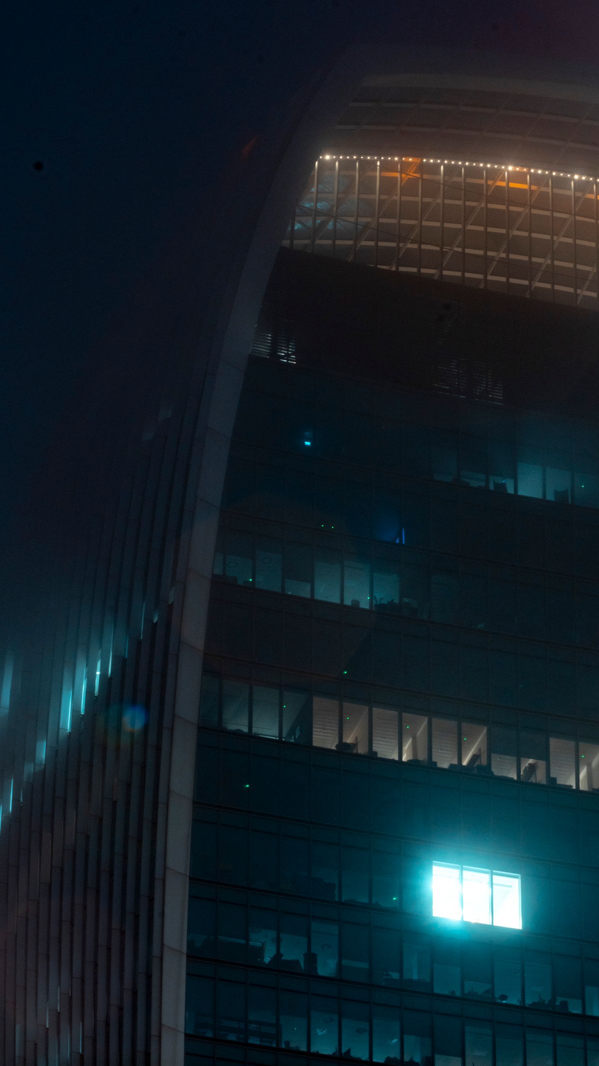 Illuminated office building in London at night