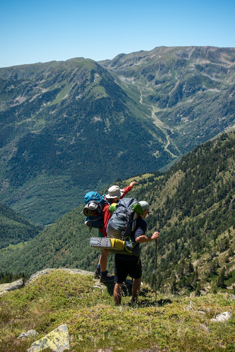 Backpackers In Mountains