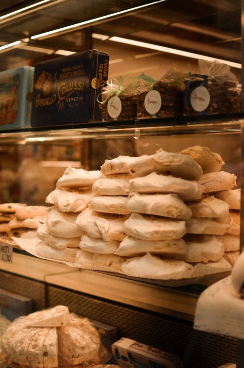 Free A close-up of traditional Italian pastries elegantly displayed in a glass cabinet in Veneto, Italy. Stock Photo