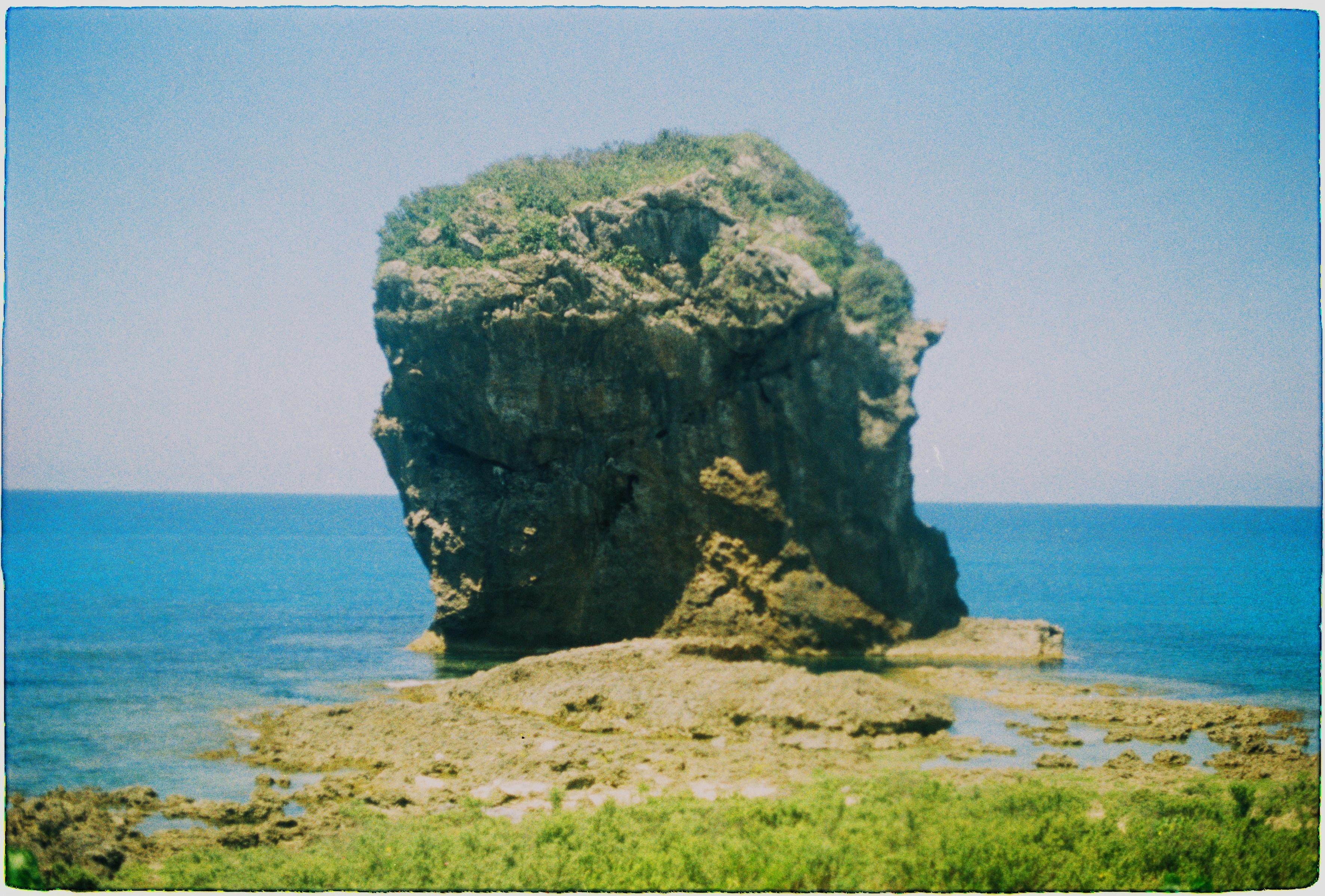 Chuanfan Rock, a majestic landmark, stands by Taiwan's beautiful sea shore