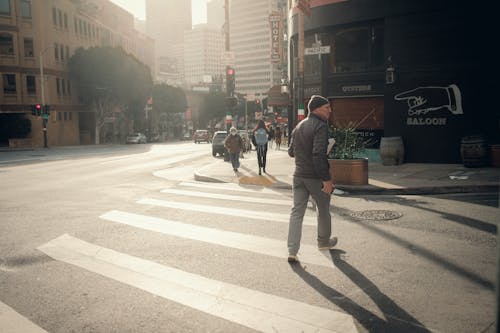 Man in Jacket Crossing Street