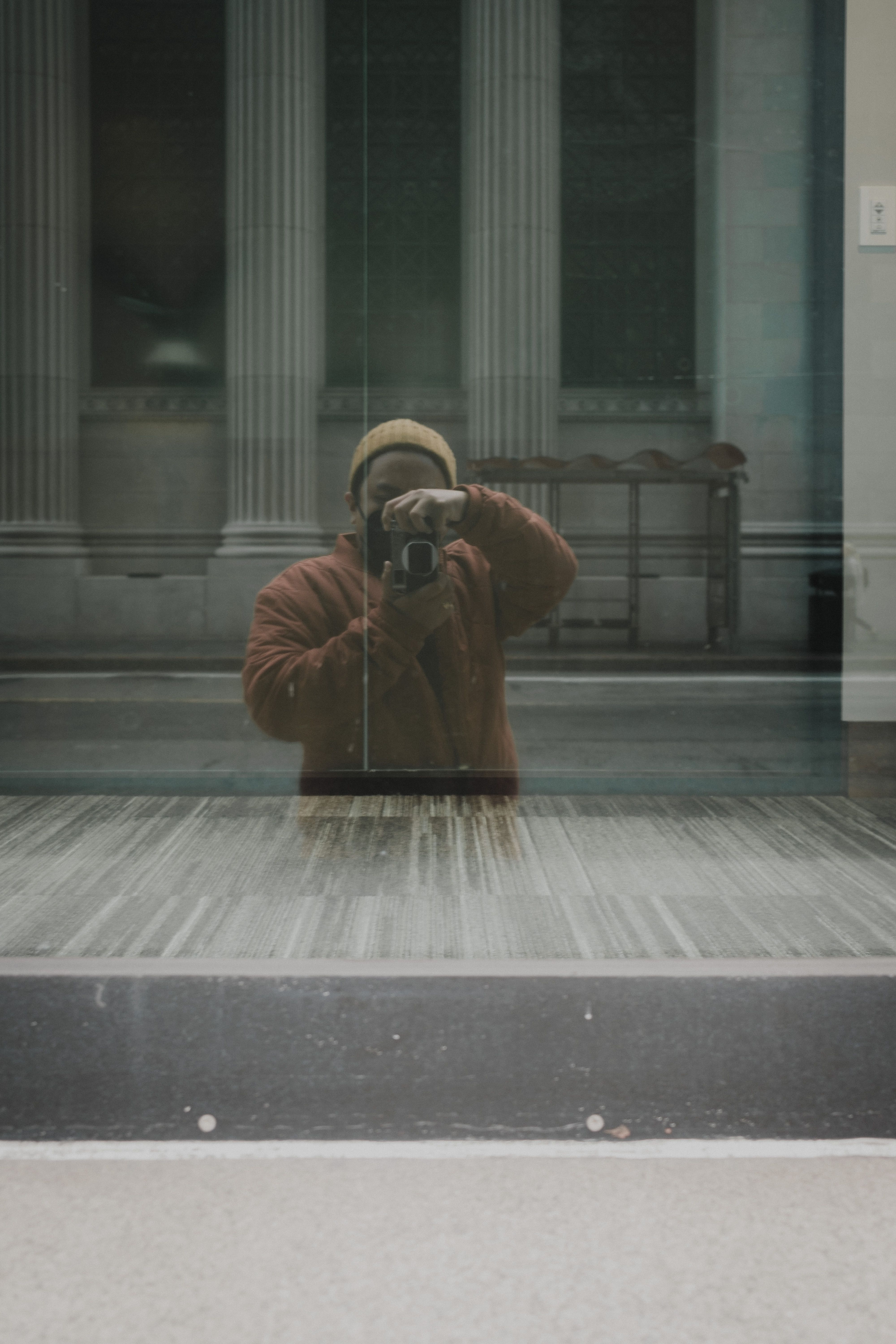 Man with Camera Taking Pictures in Window · Free Stock Photo