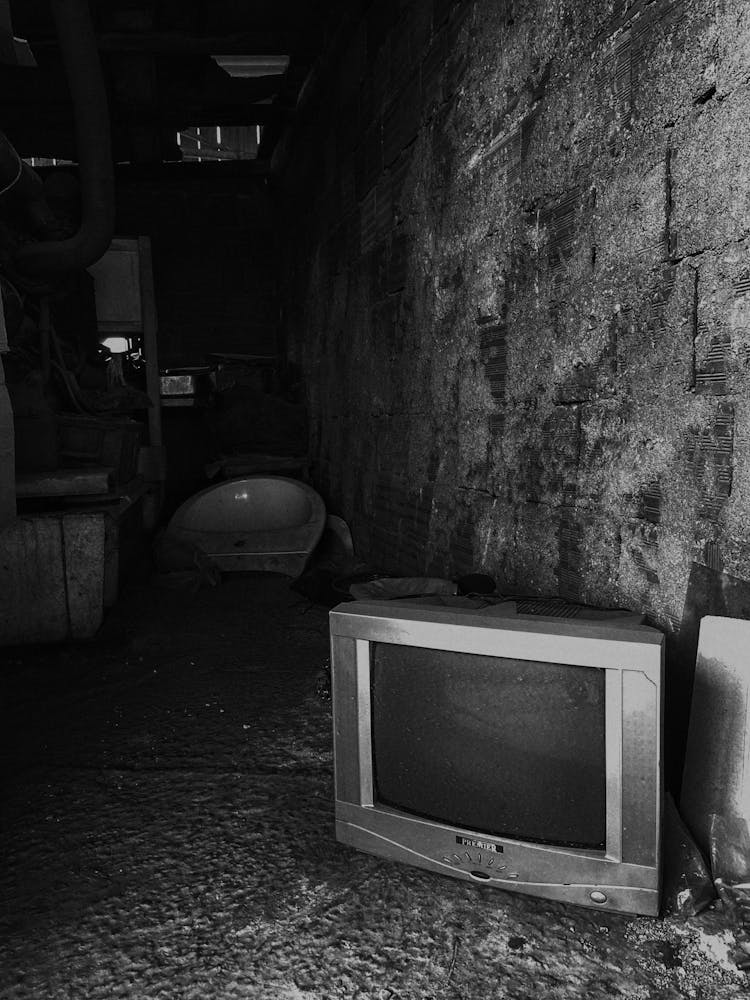 Retro TV Lying On Basement Floor