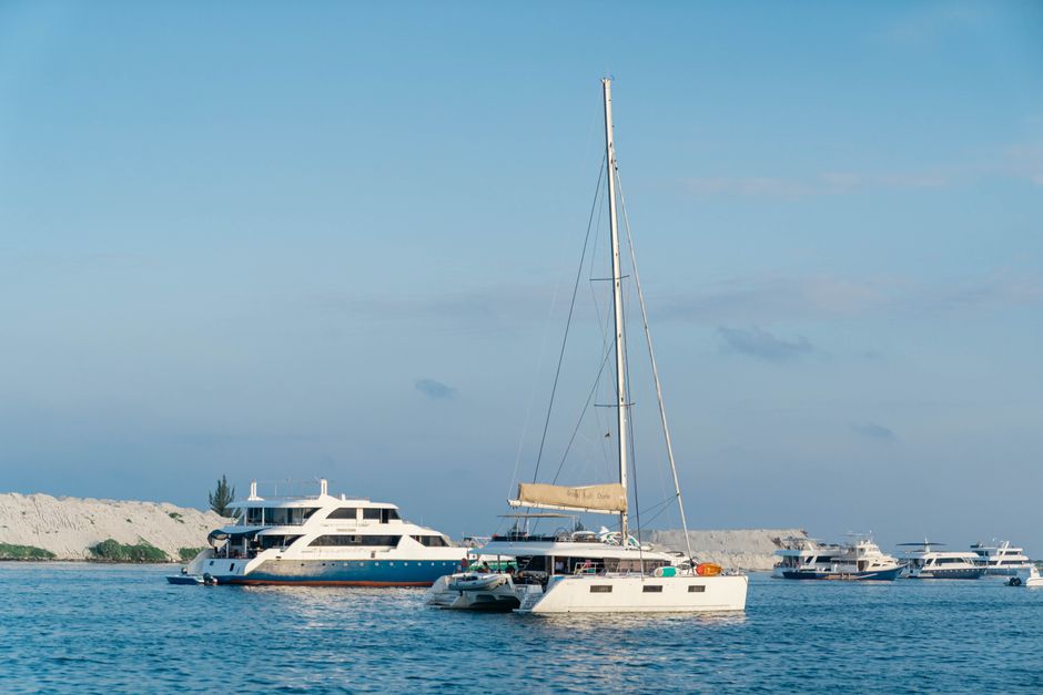 Incredible Private Yacht Rental 37Ft in Miami Up to 12 People Review: Your Complete Guide to Miami's Best Value Yacht Experience Review 2026 - Elegant yachts and sailing boats on a clear blue sea under a bright sky, ideal for travel and leisure themes.