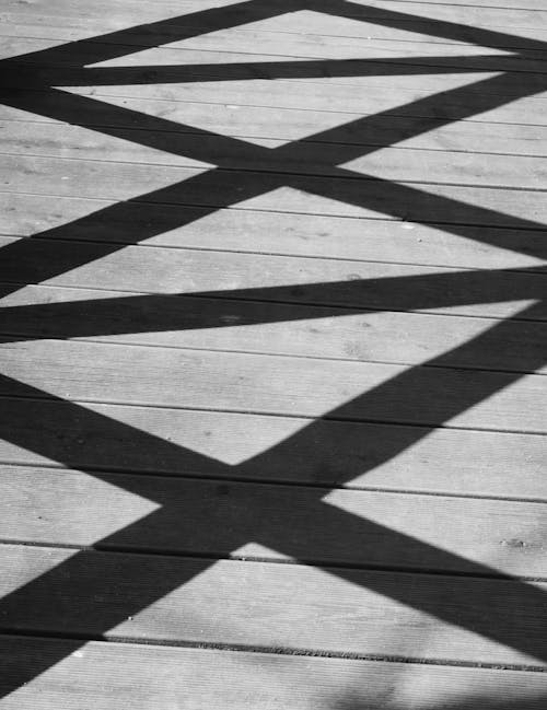 Shadow of a Fence on a Wooden Deck 