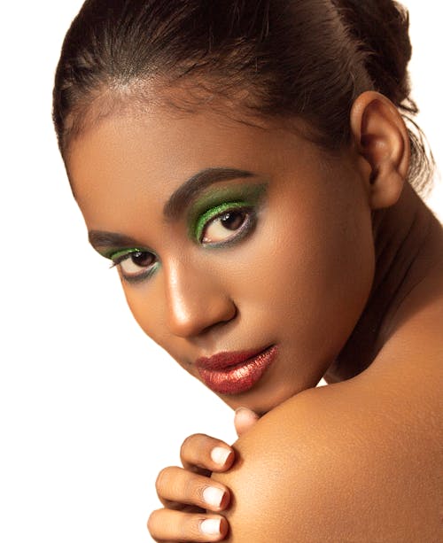 Free Portrait of a Young Woman Wearing Green Eye Makeup  Stock Photo